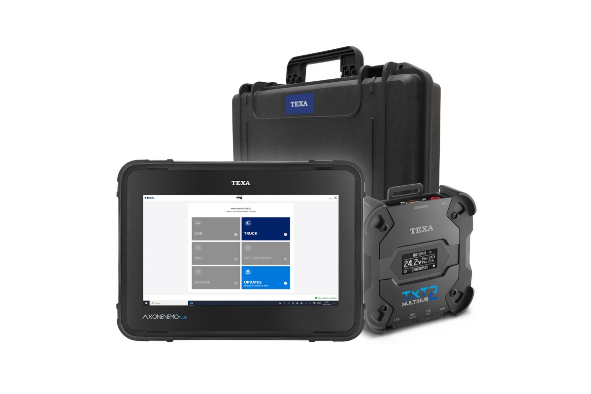 TEXA AXONE Nemo Plus Truck Kit: the tablet showing the IDC6 home screen with Truck selected, a TXT Multihub 2 with its display on, and the TEXA carry case.